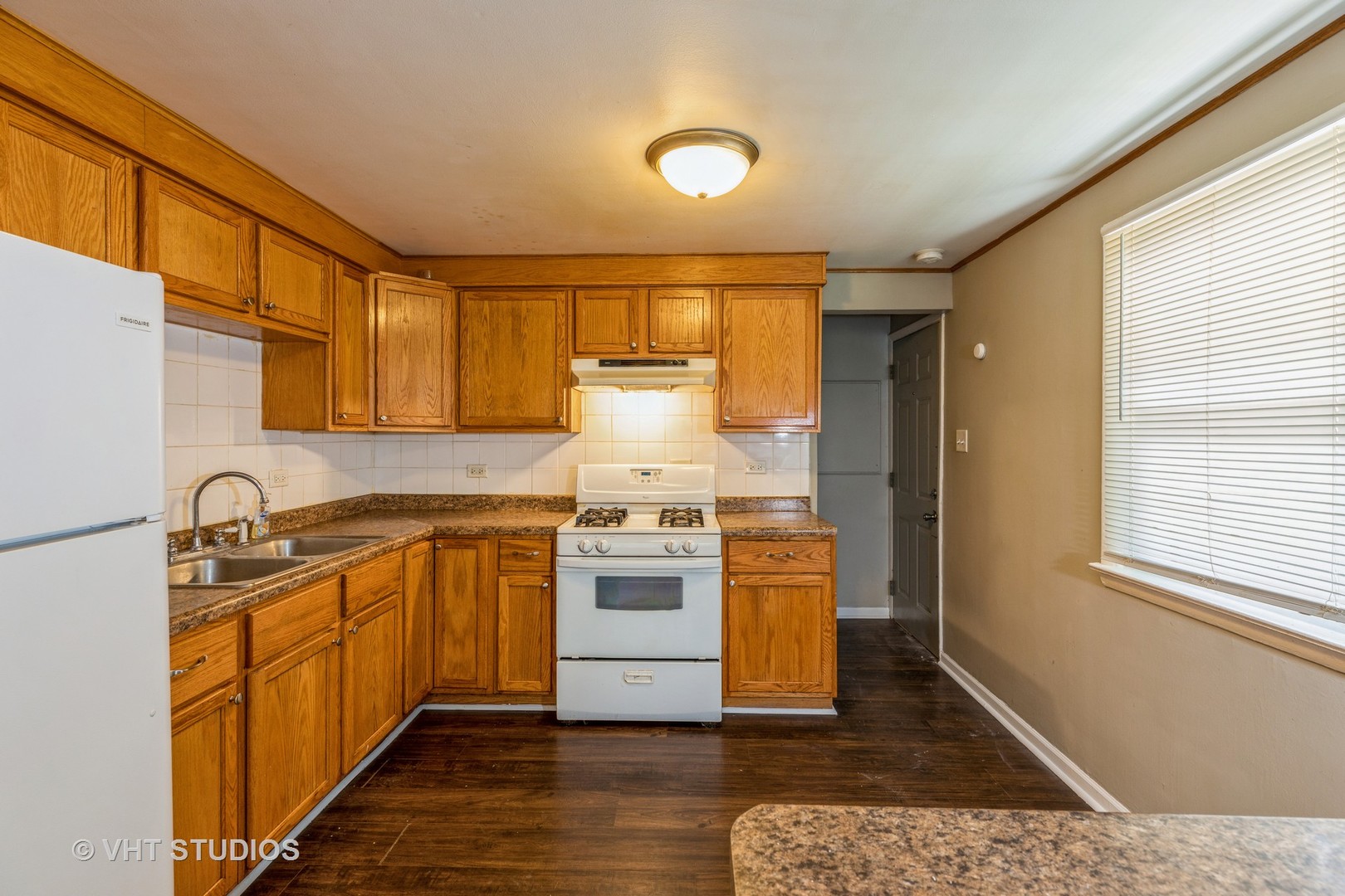 3941 169th Street Country Club Hills, IL 60478 - Photo 10 of 22 a kitchen with stainless steel appliances granite countertop a stove a sink and a refrigerator