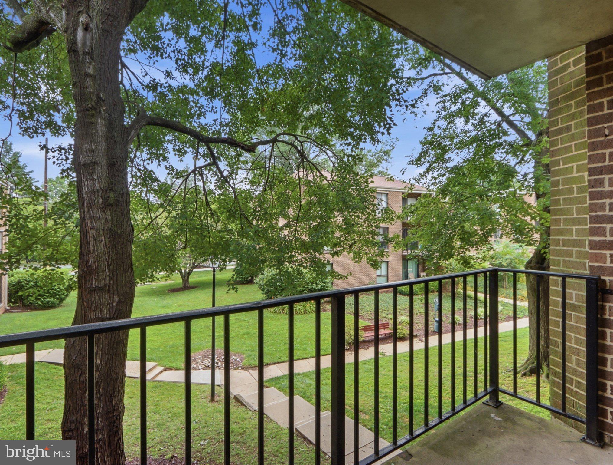 3204 Spartan Road, Unit 10 Olney, MD 20832 - Photo 24 of 31 Serene balcony view of lush greenery.