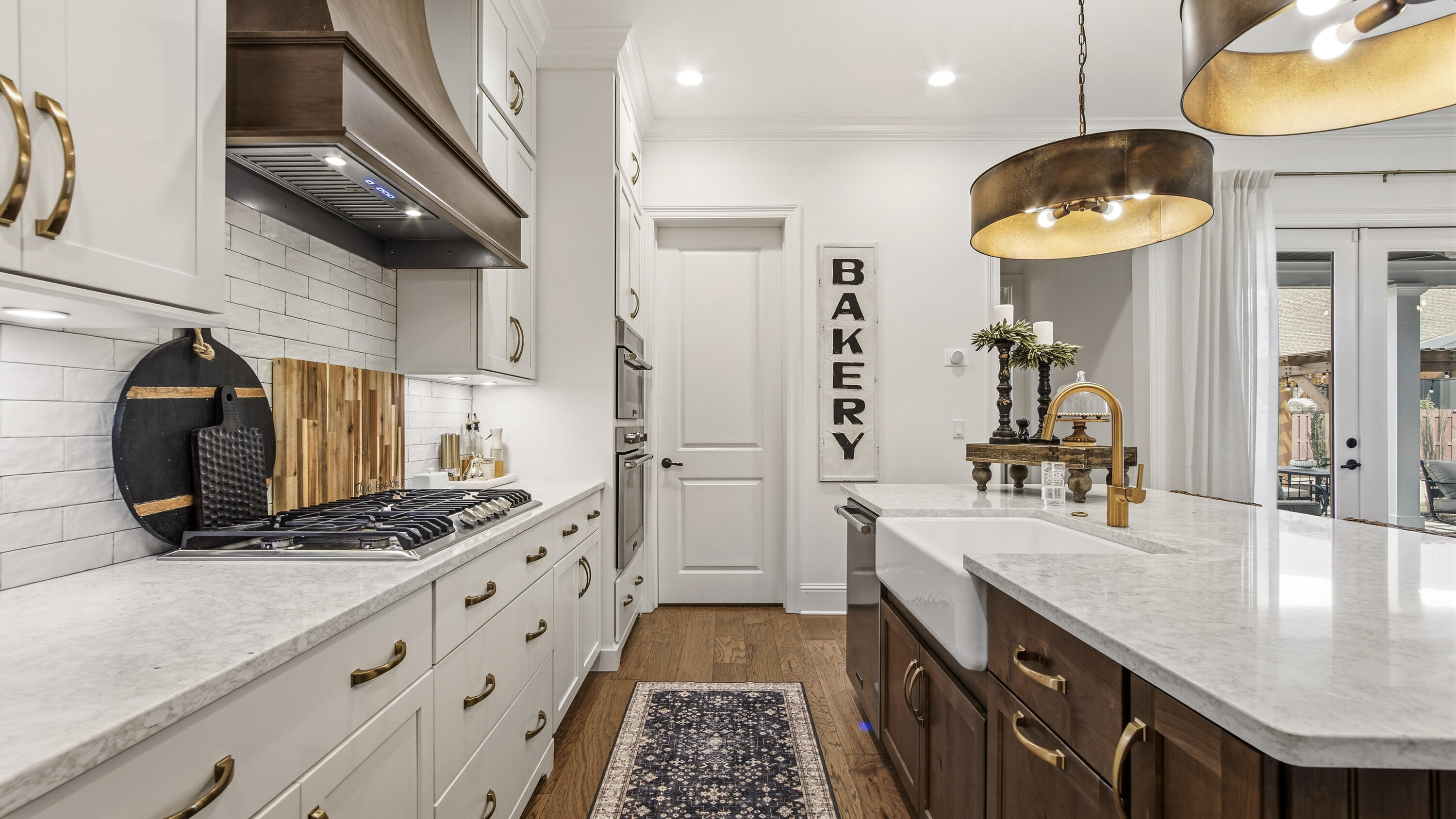 33 Caymus Cove Freeport, FL 32439 - Photo 19 of 144 a kitchen with granite countertop a sink a stove and a wooden floors