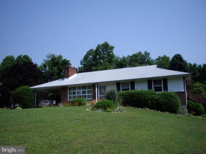 1317 Murgatroyd Road Fallston, MD 21047 - Photo 1 of 17 a front view of a house with a yard