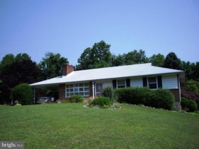 1317 Murgatroyd Road Fallston, MD 21047 - Photo 2 of 17 a view of a house with a yard and a garden