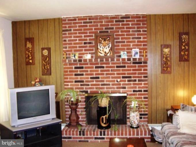 1317 Murgatroyd Road Fallston, MD 21047 - Photo 15 of 17 a living room with furniture and a fireplace