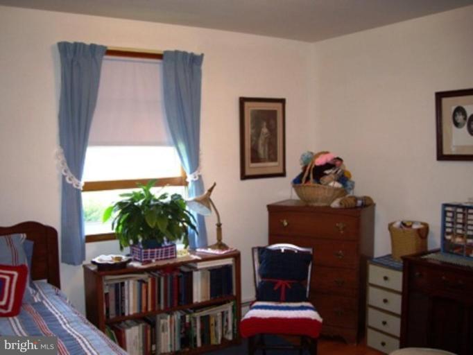 1317 Murgatroyd Road Fallston, MD 21047 - Photo 7 of 17 a living room with furniture a window and a potted plant