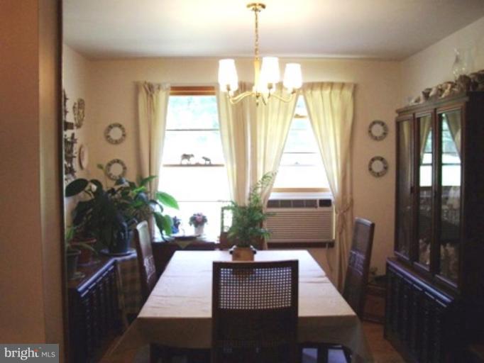 1317 Murgatroyd Road Fallston, MD 21047 - Photo 9 of 17 a view of a dining room with furniture window and wooden floor