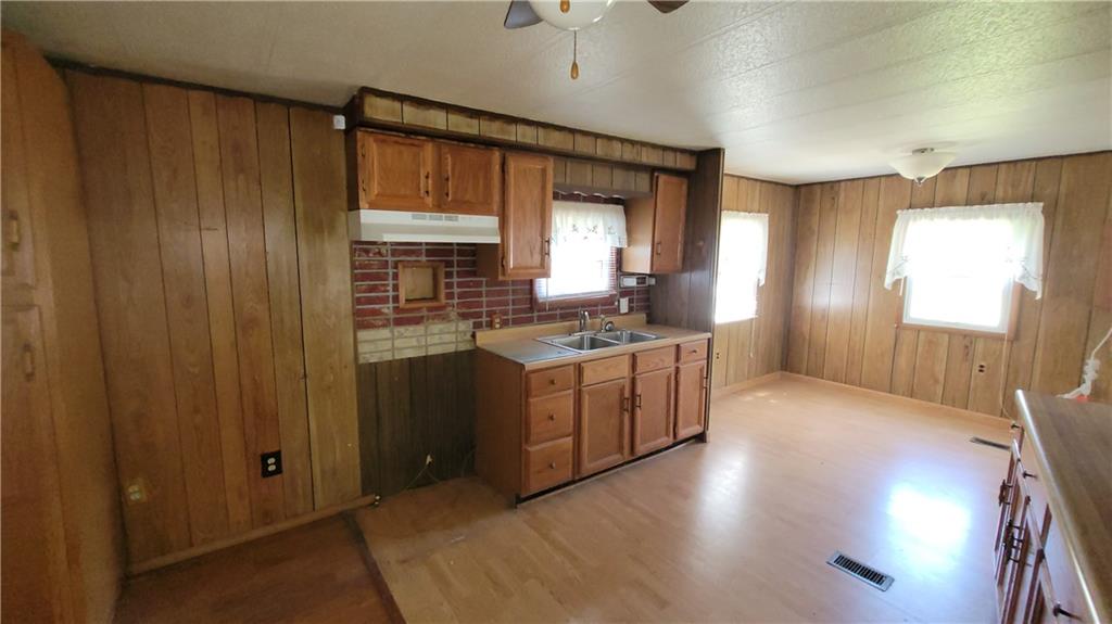 225 Lowber Road Fayette City, PA 15438 - Photo 3 of 29 a kitchen with sink cabinets and window