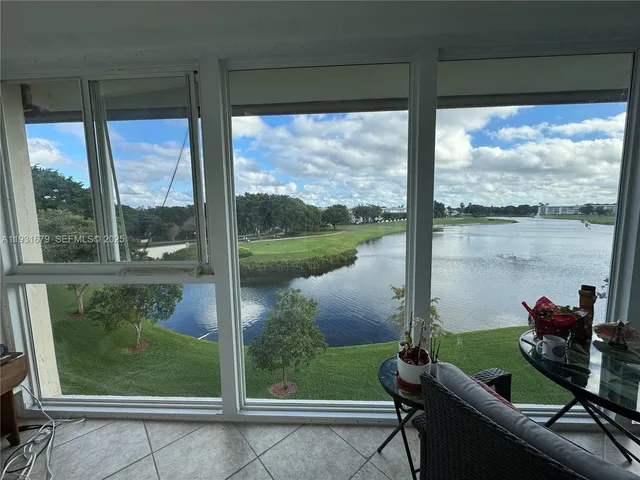 a room with furniture and a potted plant