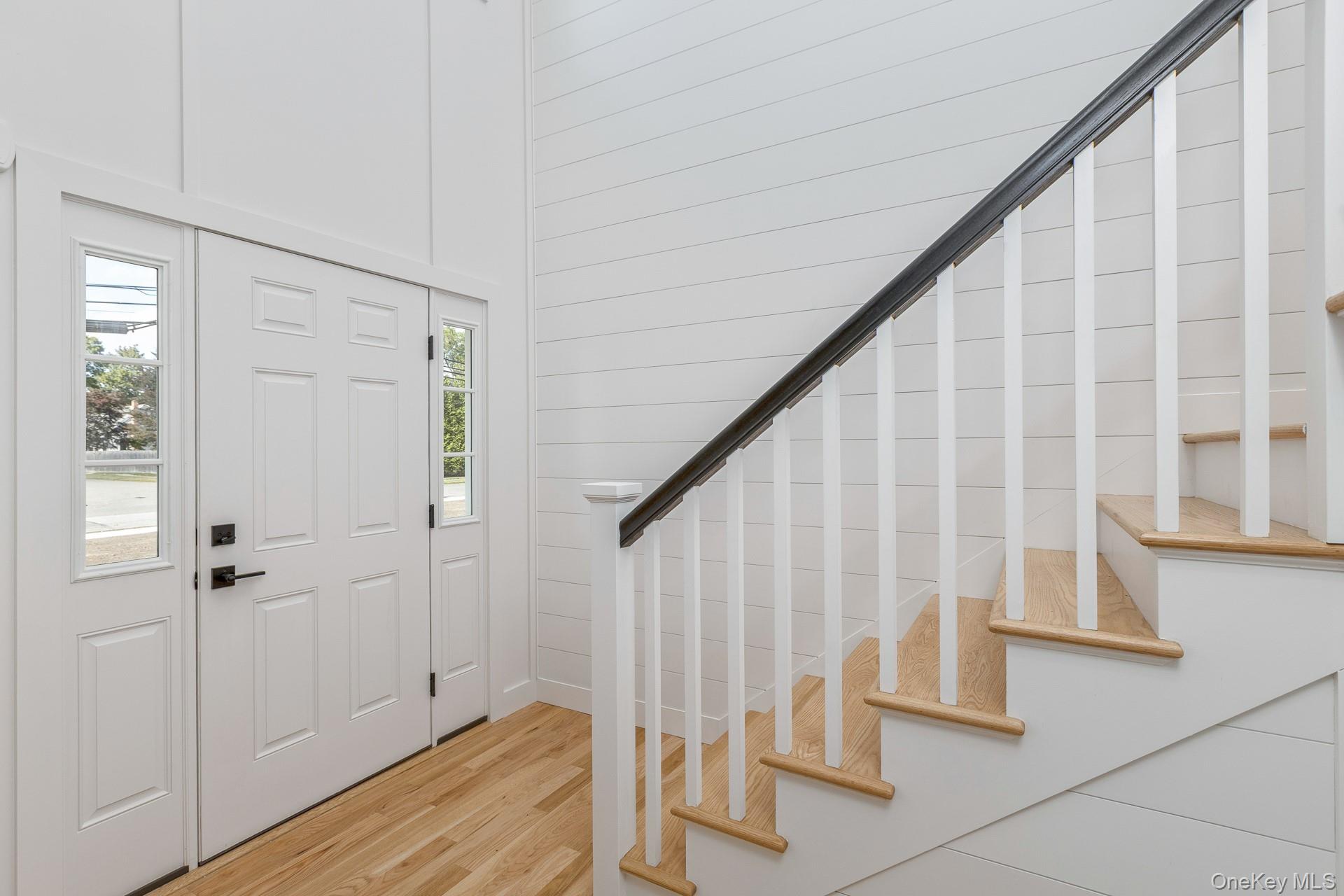 92 Park Street Blue Point, NY 11715 - Photo 6 of 32 Entrance foyer with wood finished floors and stairs