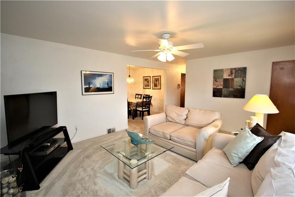 939 Dallett Road Pittsburgh, PA 15227 - Photo 4 of 24 Spacious 17x13 Living Room with Ceiling Fan and Newer Carpeting 2 yrs young. Spacious Coat Closet.