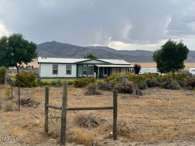 a view of a house with a yard and plants