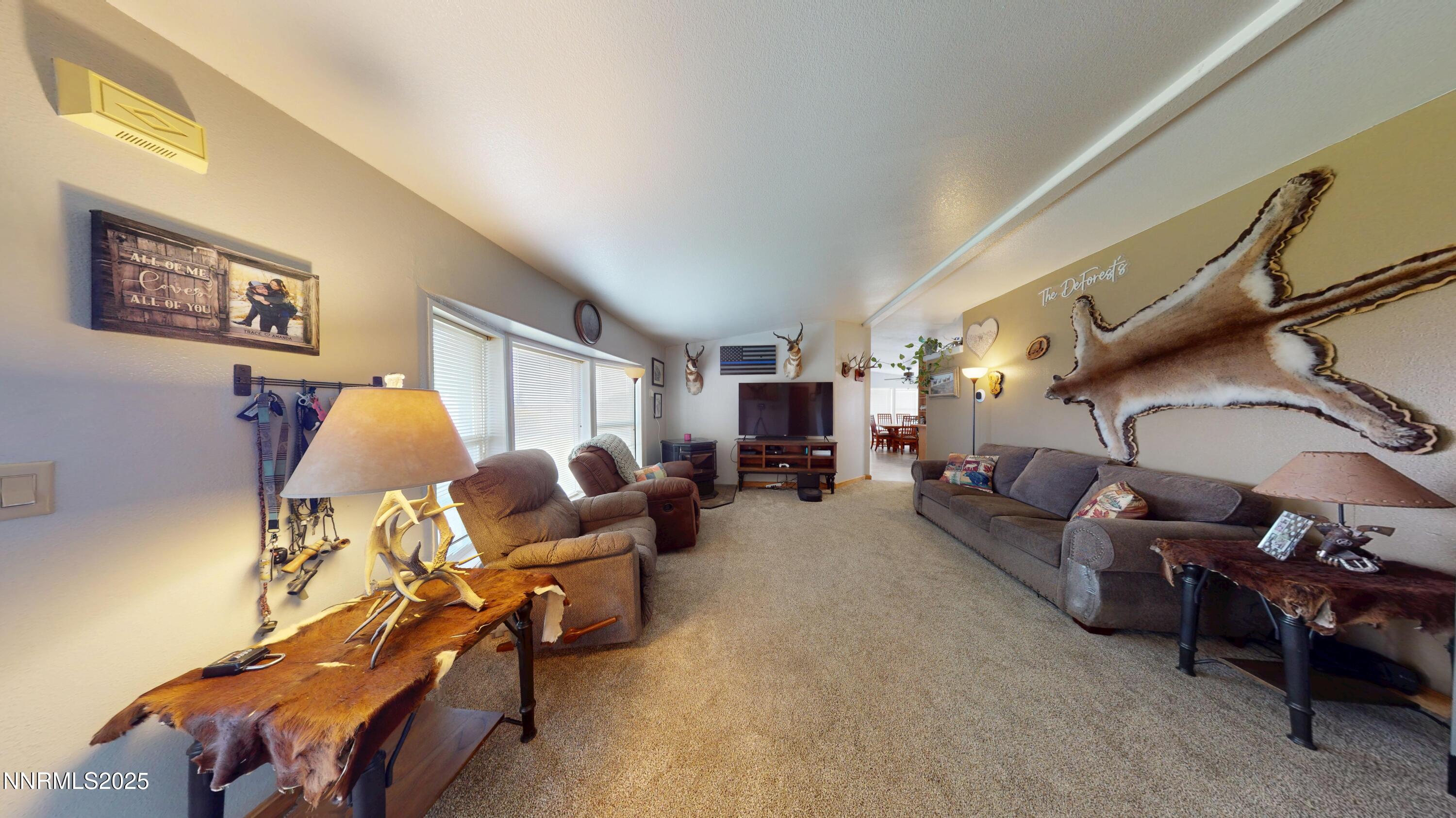 8425 Styles Court Winnemucca, NV 89445 - Photo 11 of 27 a living room with furniture and a window