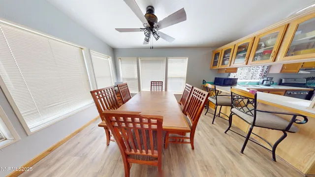 a view of a dining room with furniture window and wooden floor