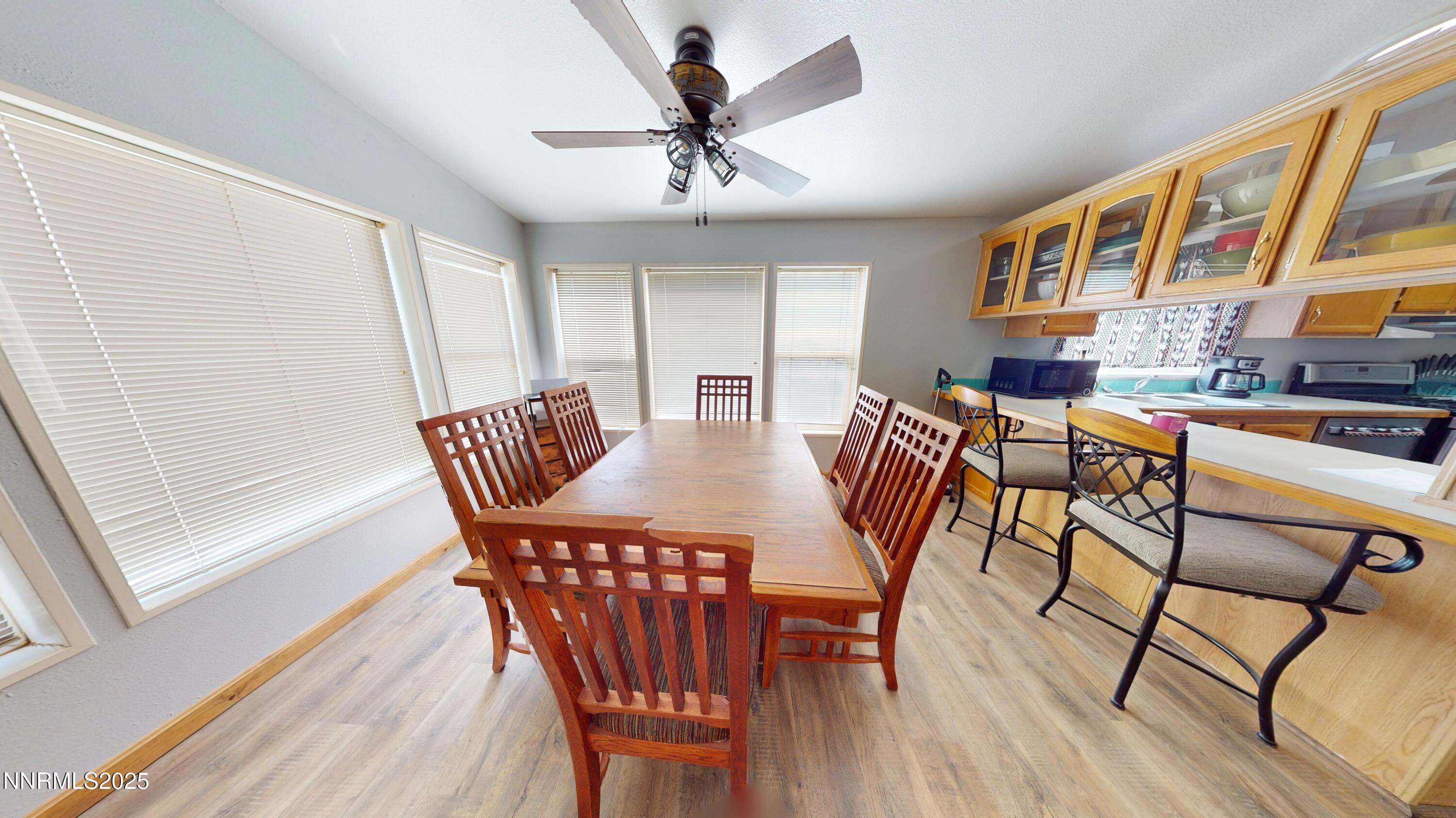 8425 Styles Court Winnemucca, NV 89445 - Photo 13 of 27 a view of a dining room with furniture window and wooden floor