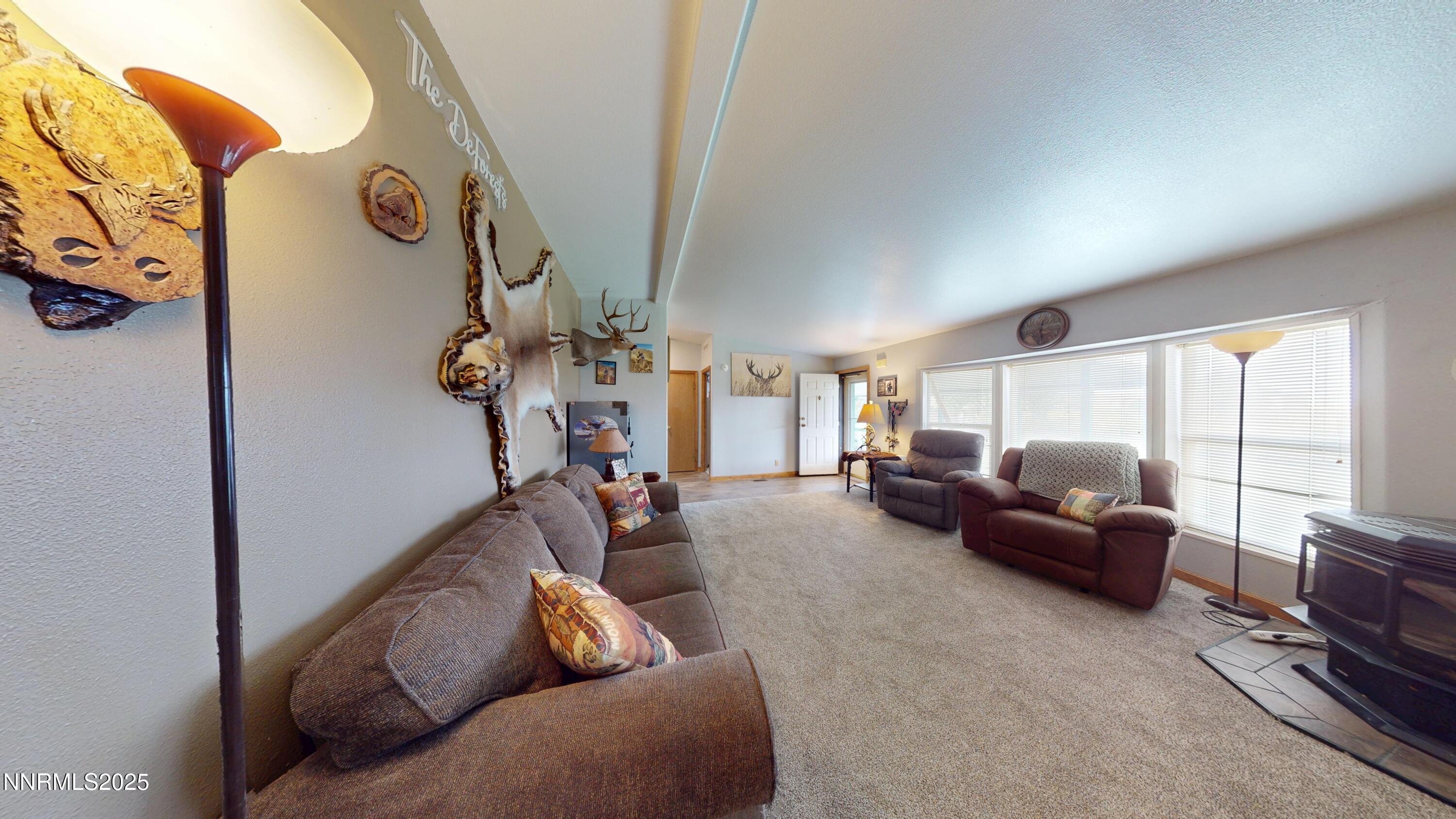 8425 Styles Court Winnemucca, NV 89445 - Photo 5 of 27 a living room with furniture and a window