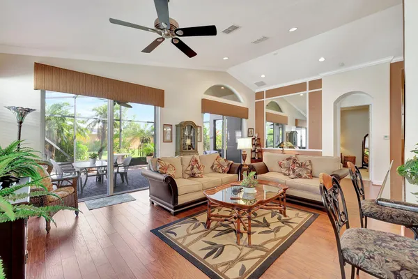 a living room with furniture and a large window