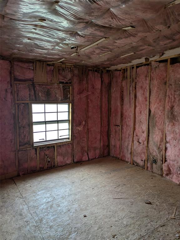 402 Marion Street Merkel, TX 79536 - Photo 14 of 23 a view of an empty room with a fireplace
