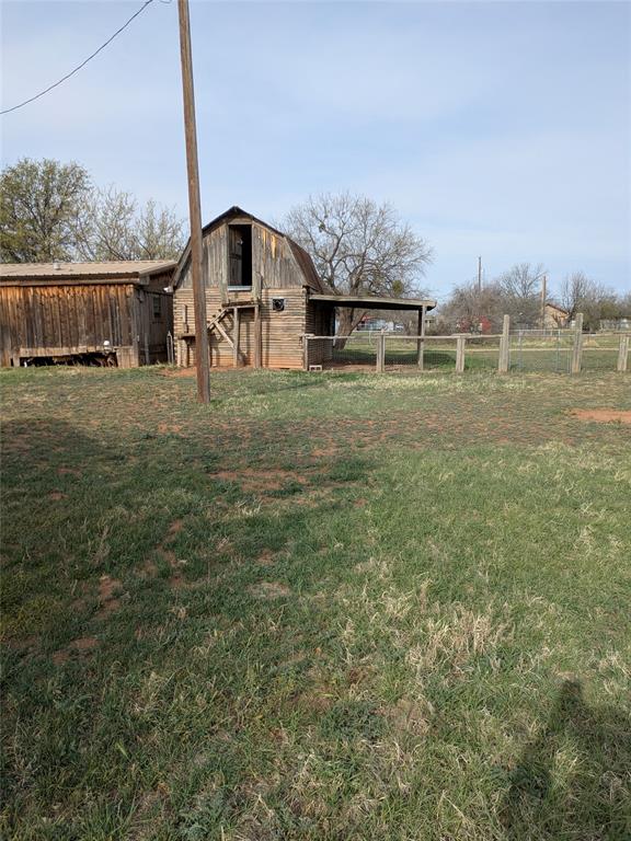402 Marion Street Merkel, TX 79536 - Photo 17 of 23 a front view of a house with a yard