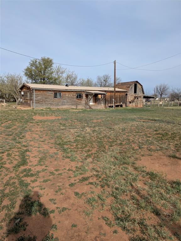 402 Marion Street Merkel, TX 79536 - Photo 20 of 23 a front view of a house with a yard