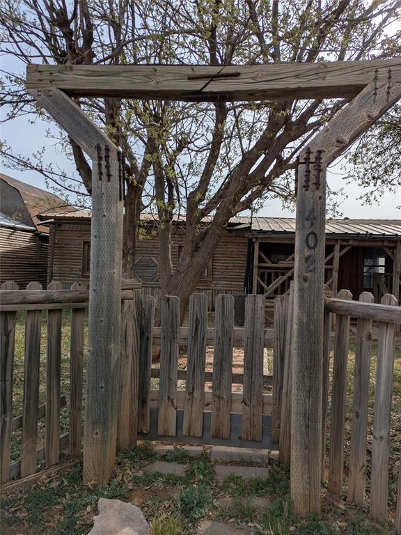 402 Marion Street Merkel, TX 79536 - Photo 3 of 23 a view of a house with a tree