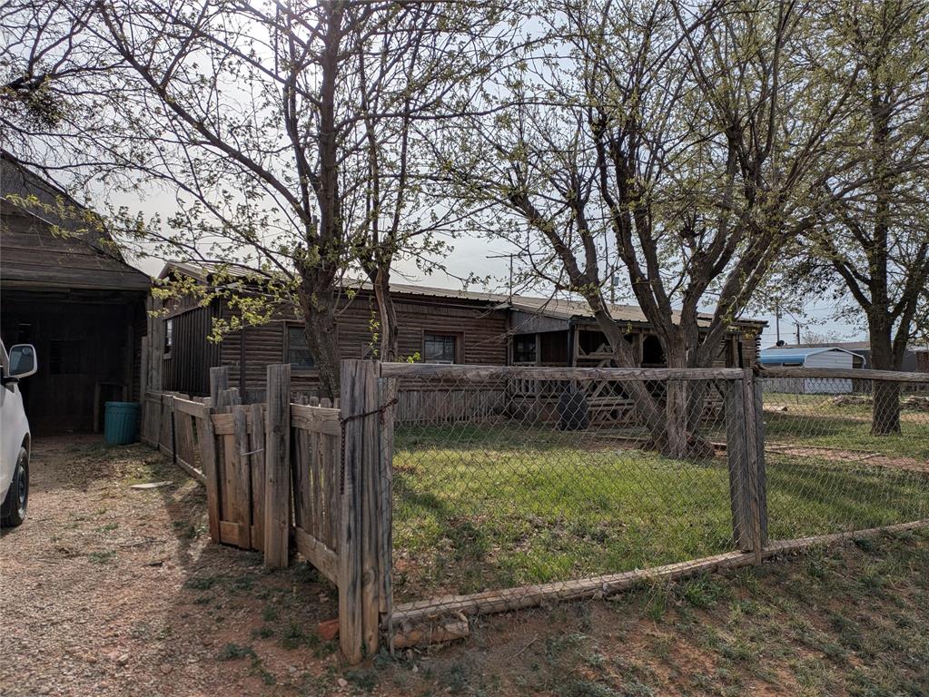 402 Marion Street Merkel, TX 79536 - Photo 4 of 23 a view of a house with a yard