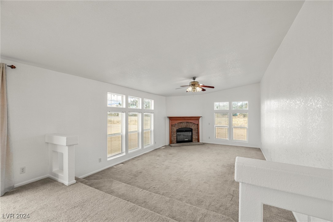 3130 McGraw Road Pahrump, NV 89061 - Photo 11 of 42 FAMILY ROOM IS SUNKEN WITH WOOD-BURNING FIREPLACE
