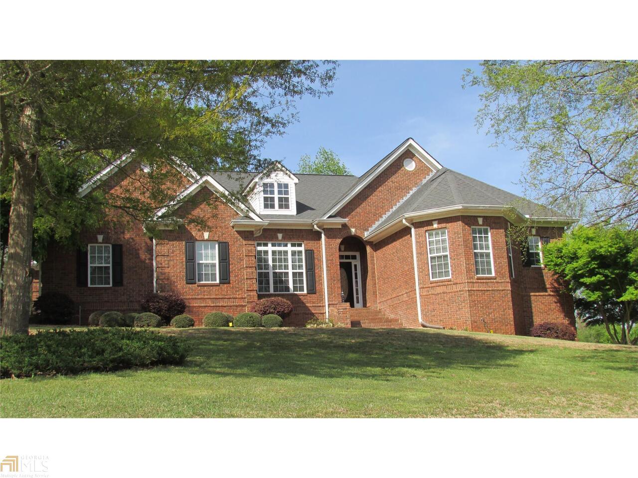 100 Walnut Ridge Way Covington, GA 30014 - Photo 1 of 1 a front view of a house with a garden