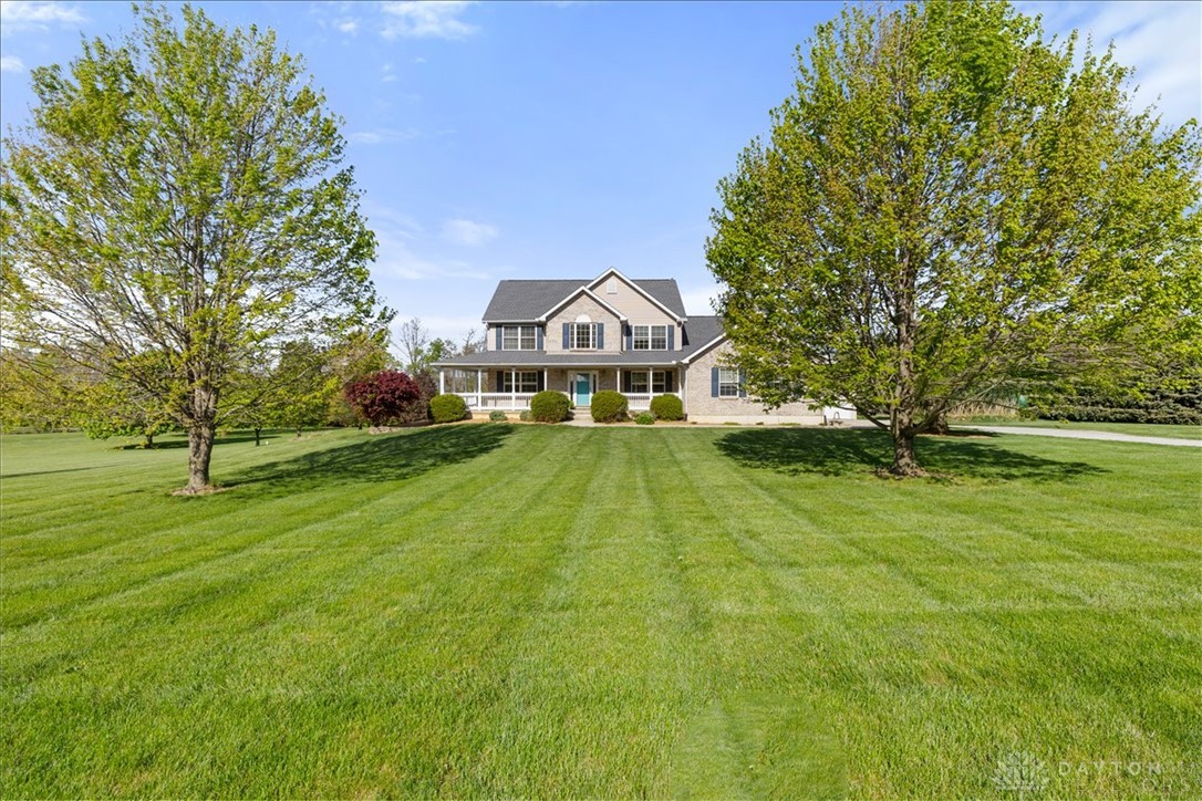 841 Willow Road Springfield, OH 45502 - Photo 49 of 64 This grand residence sits majestically amidst a sprawling lawn, offering a serene countryside escape.