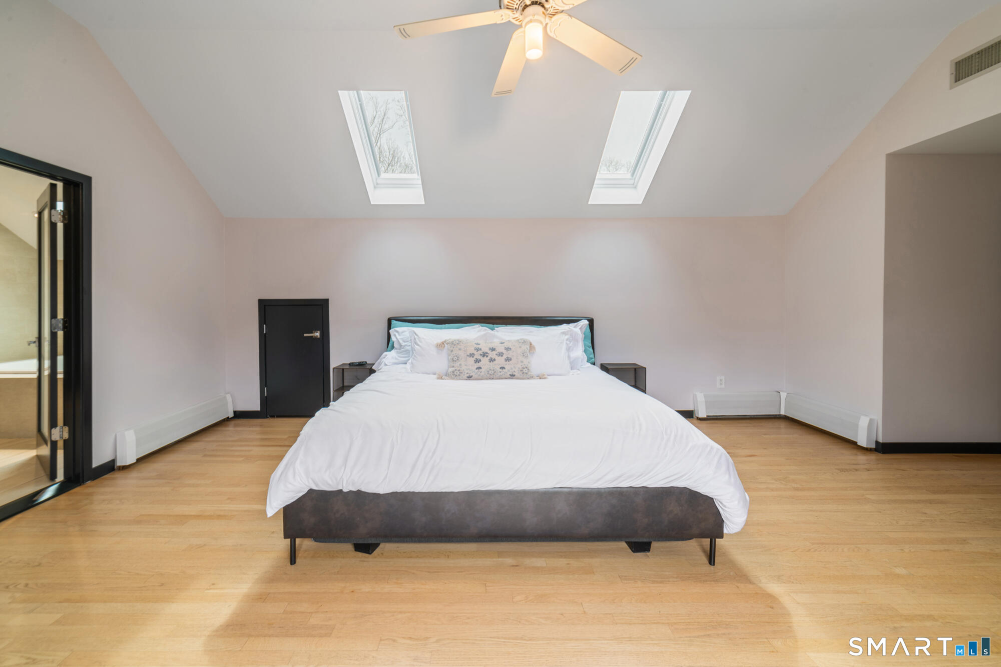 14 Fox Ridge Guilford, CT 06437 - Photo 19 of 39 a bedroom with a bed and a painting on the wall