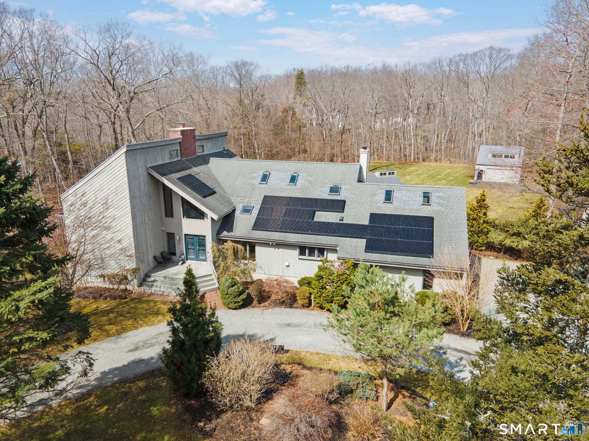 14 Fox Ridge Guilford, CT 06437 - Photo 2 of 39 a view of a house with a yard and large trees