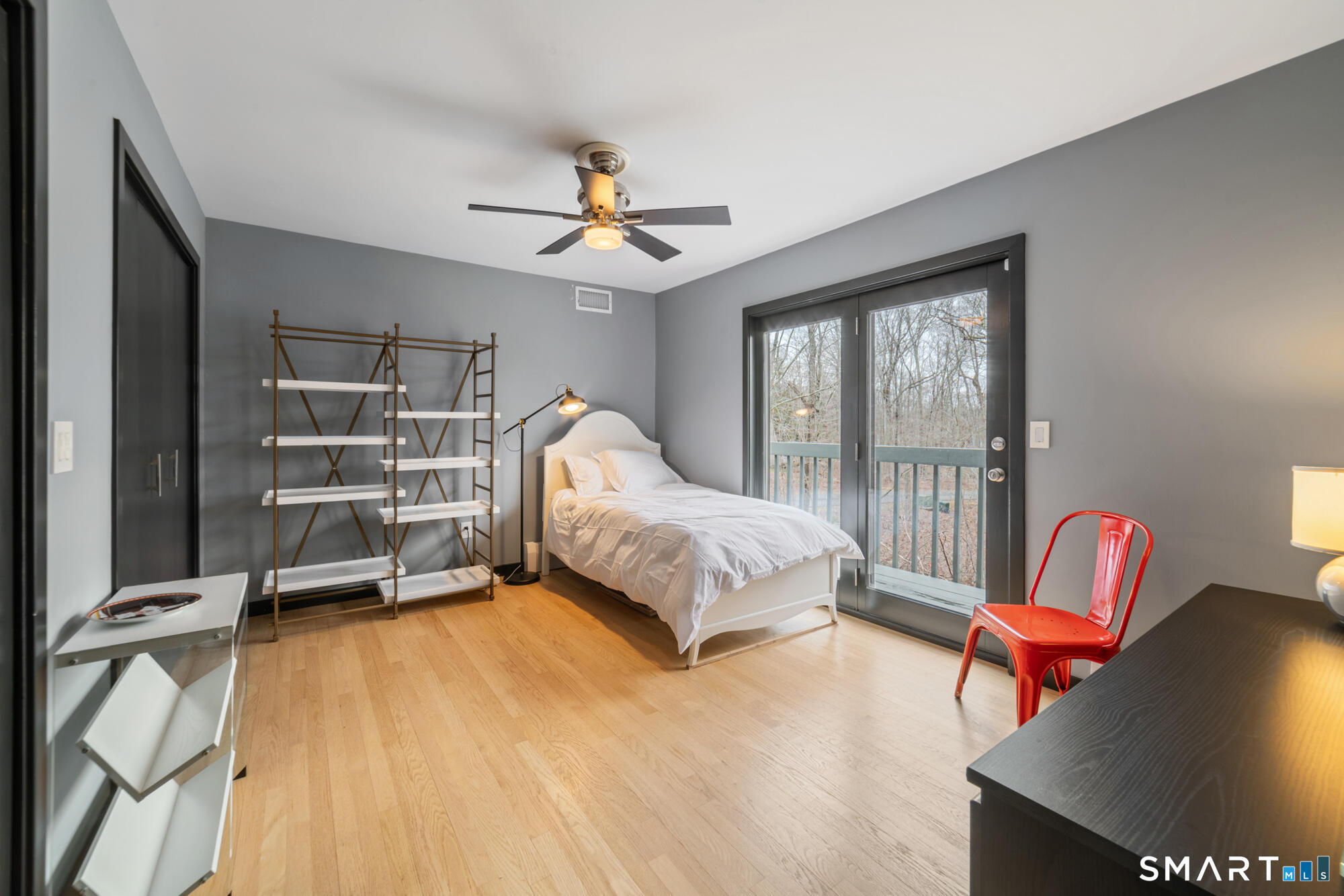 14 Fox Ridge Guilford, CT 06437 - Photo 23 of 39 a bedroom with a bed and a chandelier