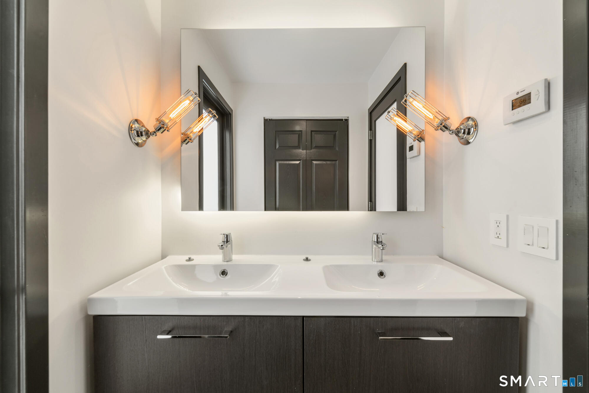 14 Fox Ridge Guilford, CT 06437 - Photo 25 of 39 a bathroom with a sink and a mirror