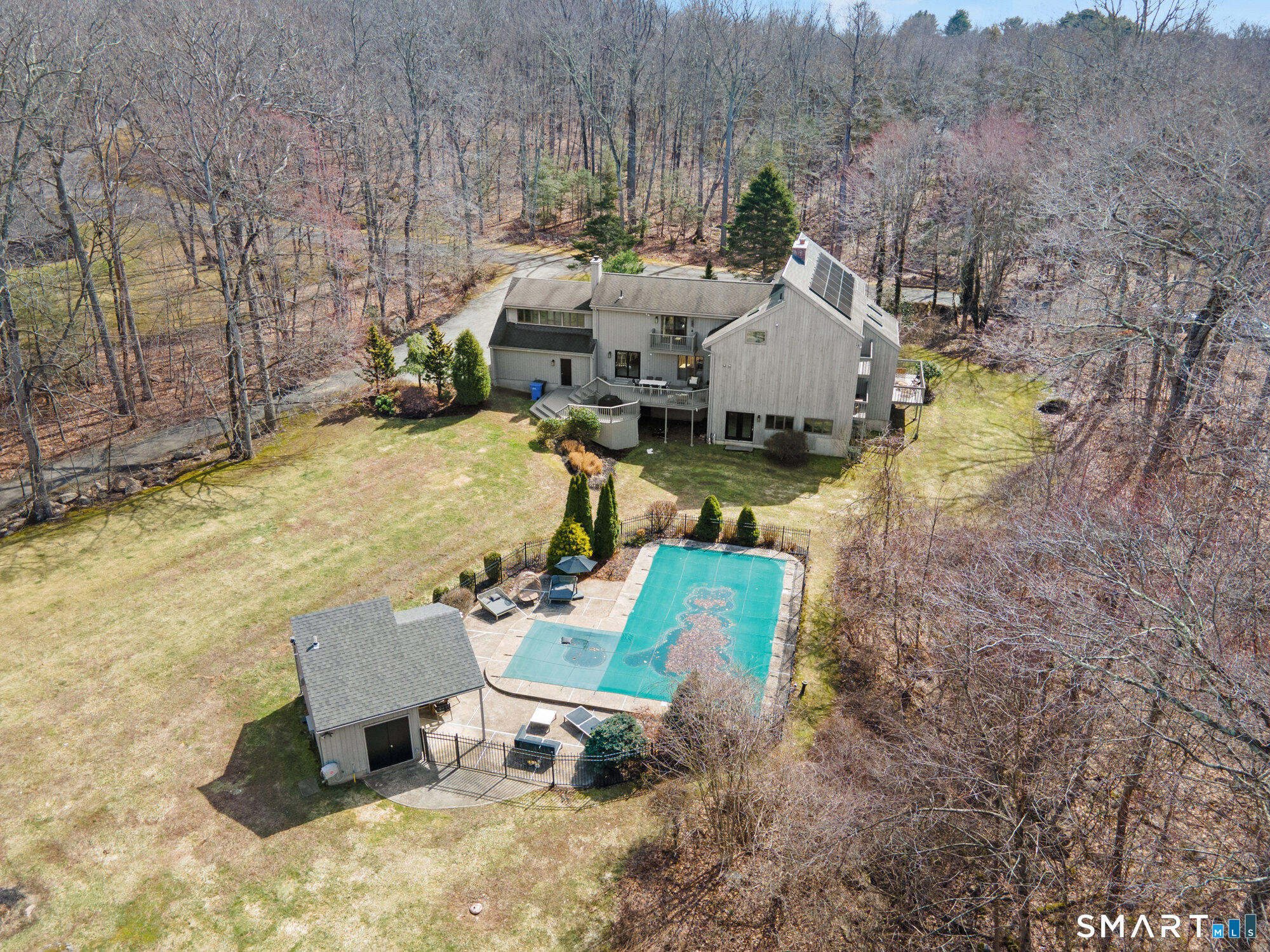 14 Fox Ridge Guilford, CT 06437 - Photo 3 of 39 a aerial view of a house with table and chairs
