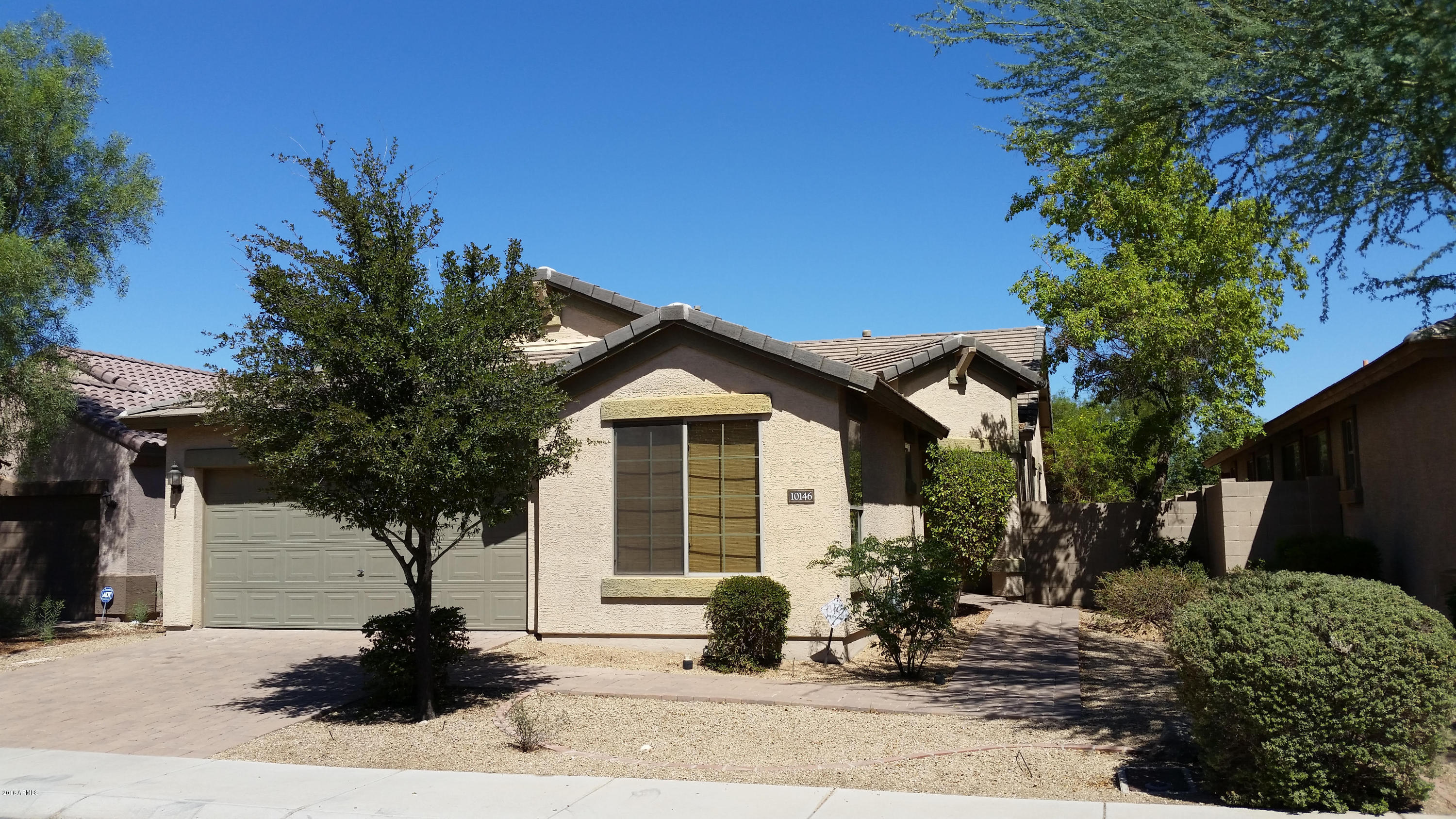 10146 West Payson Road Tolleson, AZ 85353 - Photo 1 of 18 a front view of a house with a yard