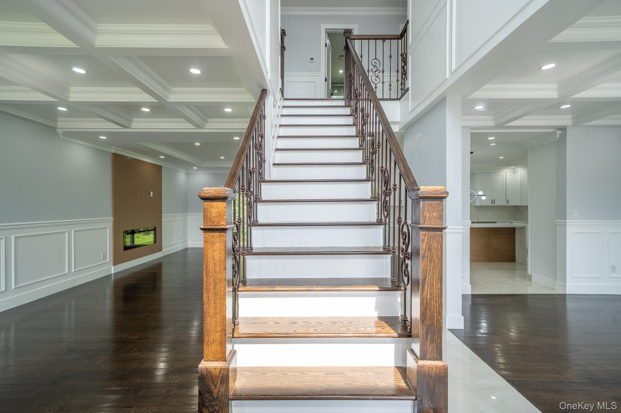 770 Cedar Street Syosset, NY 11791 - Photo 4 of 35 Stairway with a decorative wall, wainscoting, coffered ceiling, beam ceiling, and crown molding