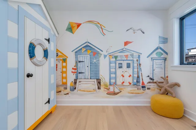 a view of a room with wooden floor and white walls