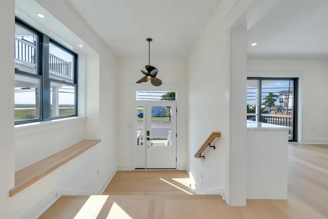 a room with a window and furniture