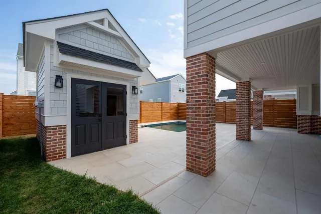 a view of a house with a barbeque