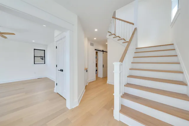 a kitchen with stainless steel appliances a stove sink and cabinets