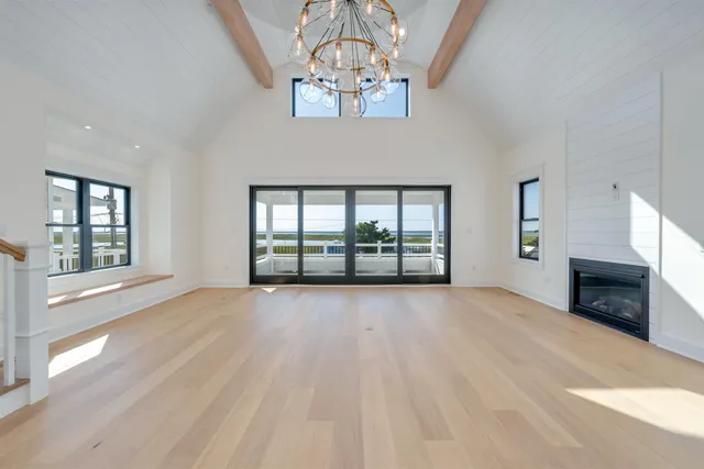 a view of an entryway with wooden floor