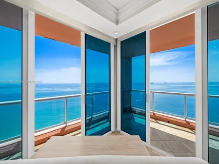 a balcony with an ocean view
