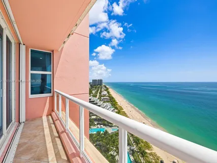 a kitchen with stainless steel appliances a sink and a large window