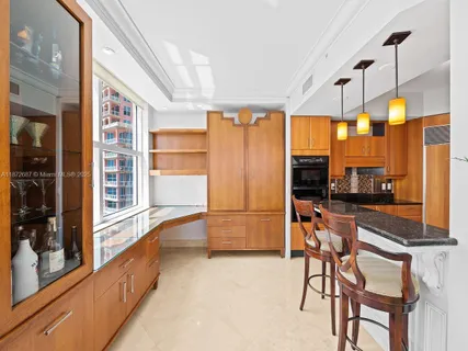 a living room with furniture and large windows