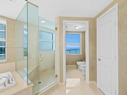 a bathroom with a tub and window