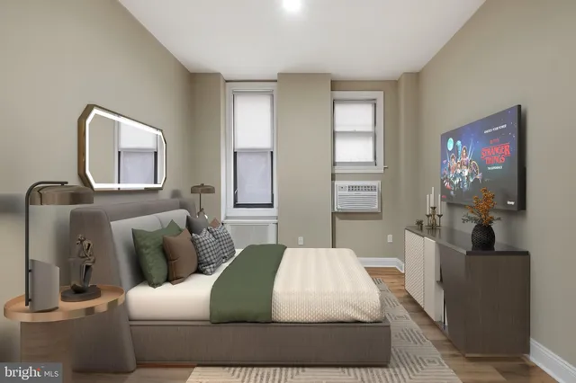 a bedroom with a bed and a couch