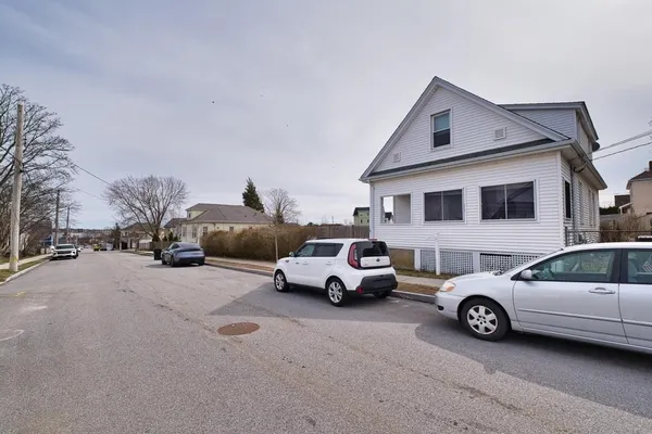 a view of a car parked in front of a house
