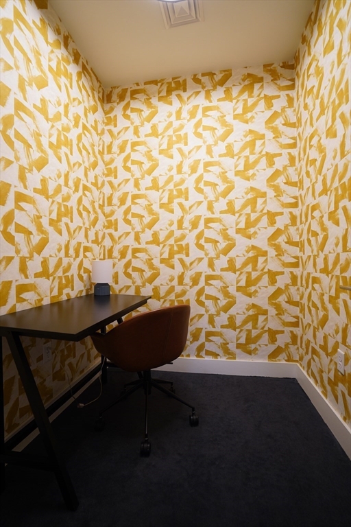 289 Walk Hill Street, Unit 327 Boston, MA 02131 - Photo 14 of 31 a room with table and chairs