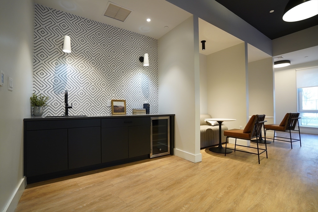 289 Walk Hill Street, Unit 327 Boston, MA 02131 - Photo 15 of 31 a view of a workspace with furniture