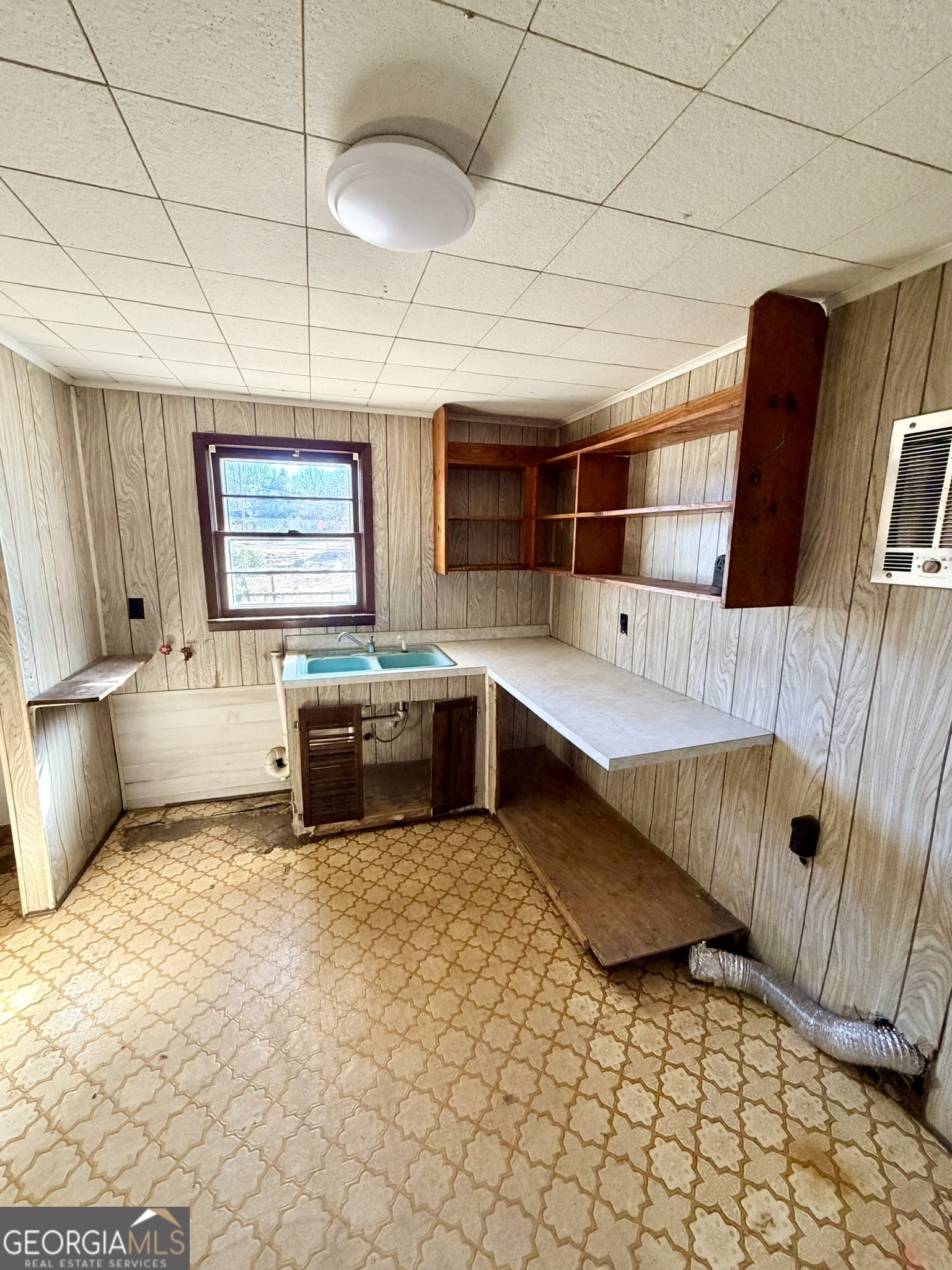 102 Lee Street Centerville, GA 31028 - Photo 15 of 30 a kitchen with a sink and cabinets