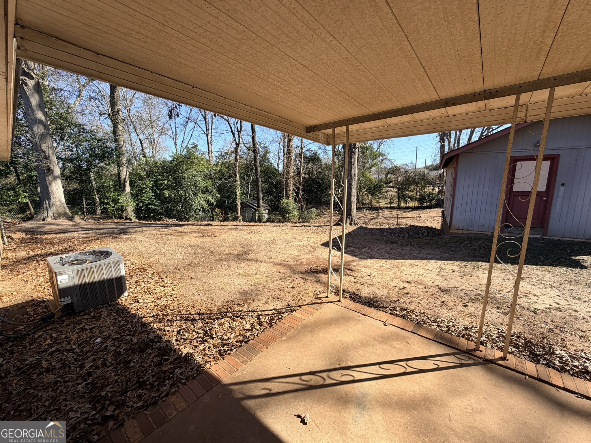 102 Lee Street Centerville, GA 31028 - Photo 17 of 30 a backyard of a house with yard and outdoor seating