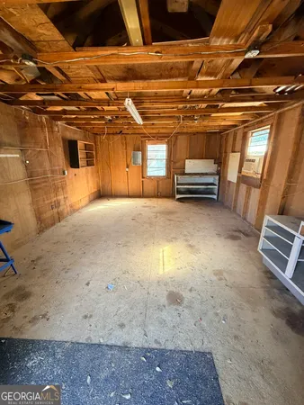 a view of an empty room with a chair