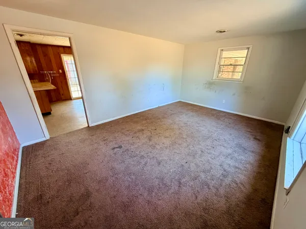 an empty room with windows